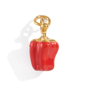 Macro view of a 18K gold-plated red bell pepper pendant with textured enamel finish
