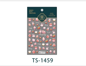 Detail of 3D embossed nail art stickers featuring strawberry cake and rabbit designs