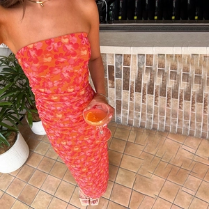 Ruched floral mesh tube maxi dress in orange and red for spring summer 2025 fashion