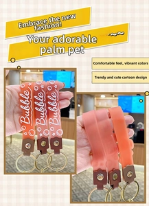 Detail of colorful silicone Bubble tea keychain straps with golden metal clasp rings