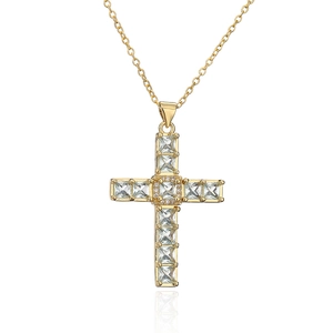 Detail of gold-plated cross pendant necklace with square and round zircon stones