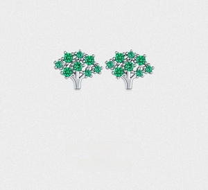 Detailed close-up of S925 sterling silver tree earrings with green zircon stones