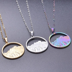 Detailed view of circular mountain pendant necklaces in gold, silver and rainbow finishes