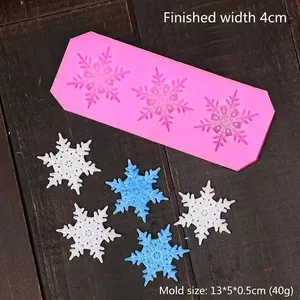 Pink silicone snowflake mold for fondant and chocolate, size 13x5cm with three cavities