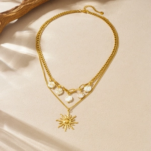 Double-layered gold stainless steel necklace with sun pendant and white textured beads