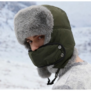 Detail of army green winter trapper hat with gray faux fur lining and ear flaps