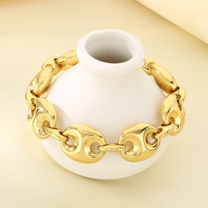 Elegant 18k gold plated stainless steel pig nose chain bracelet on white ceramic vase