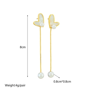 Gold heart drop earrings with white shell and pearl tassels, measuring 8cm length