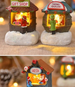Macro detail of glowing resin Christmas gift shop house with festive LED lights