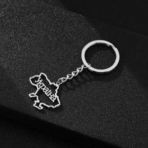 Detailed view of silver stainless steel Ukraine map keychain with cutout text design