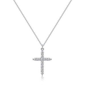 Macro shot of silver stainless steel cross pendant necklace with sparkling cubic zirconia