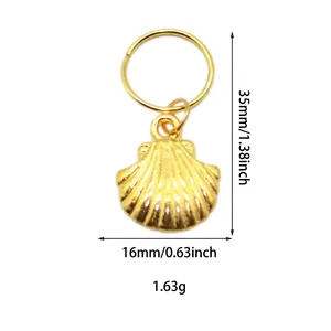 Detailed view of golden shell pendant for hair charms with 35mm height and 16mm width