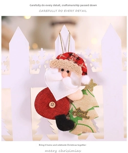 Detail of fabric Santa and Christmas tree ornament with golden hanging string