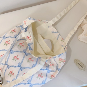 Detail view of large floral tote bag showing spacious interior and inside pocket storage