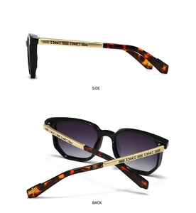 Detail view showing golden engraved temples and gradient lenses of pilot sunglasses