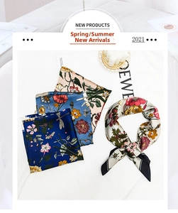 Close-up of floral silk scarf featuring realistic red poppy and dragonfly patterns