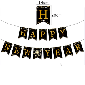 Gold and black Happy New Year banner set with fireworks and star patterns for party decor