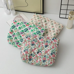 Quilted floral makeup bag set in three patterns for travel storage and toiletries
