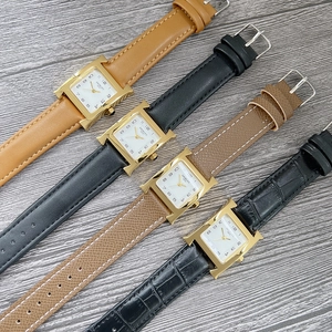 Collection of square women's watches with golden H-shaped cases and leather straps