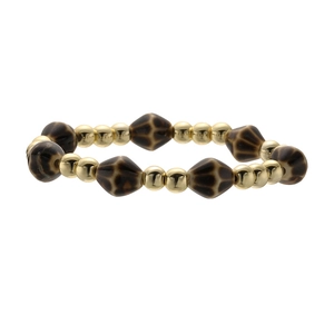 Detailed shot of elastic beaded bracelet with gold beads and leopard print diamond ceramic beads