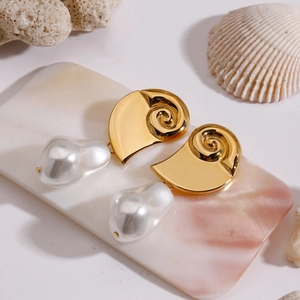 Elegant 18K gold plated seashell earrings with baroque pearls on coral background