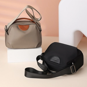 Waterproof Oxford fabric shoulder bags in khaki and black with minimalist geometric design