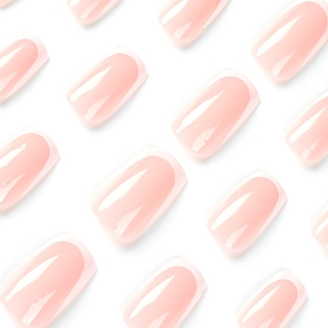 Minimalist white French tip press-on nails in soft nude pink with a glossy finish