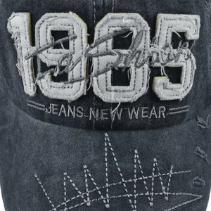Front view of washed dark grey baseball cap featuring 1985 embroidery and distressed denim