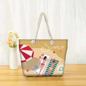 Canvas beach tote bag with rope handles and summer beach illustration on wooden table