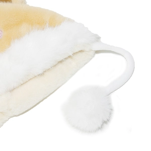 Close-up of soft plush teddy bear winter hat with white pom-pom and thick faux fur texture