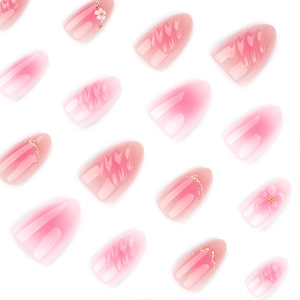 Pink gradient almond press-on nails with 3D floral accents and water ripple textures