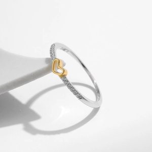 Elegant s925 silver ring featuring a golden heart and sparkling pavé crystals