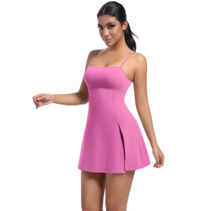 Detailed side view of pink tennis dress featuring a functional slit and soft sports fabric