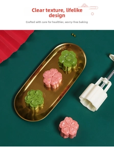 Detail showing hand-press mold creating intricate flower patterns for mooncakes