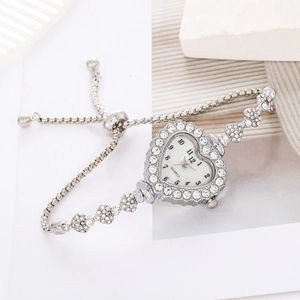 Elegant heart-shaped women's watch with rhinestone-studded bezel and silver chain strap