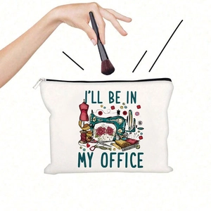 Detail of white canvas pouch with sewing machine print and zipper closure for storage