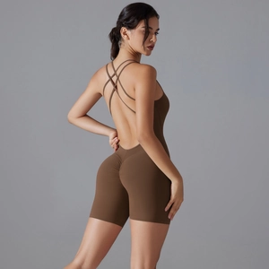 Detail of dark brown yoga bodysuit showing back cross straps and scrunch butt lifting effect