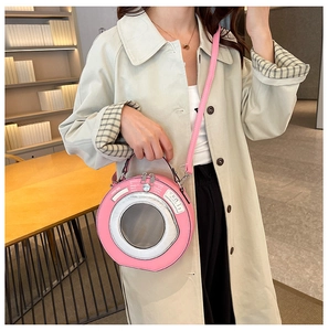 Pink washing machine shape handbag with transparent window and crossbody strap detail