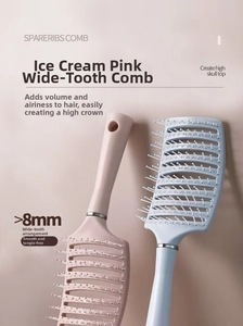 Detail of pink and blue curved vented hairbrushes with wide-spaced massaging bristles