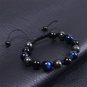 Verstellbares 10mm blaues Tigerauge-Perlenarmband mit handgewebter Kordel und metallischen Akzenten