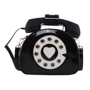 Creative retro telephone-shaped shoulder bag in black patent leather with rotary dial design