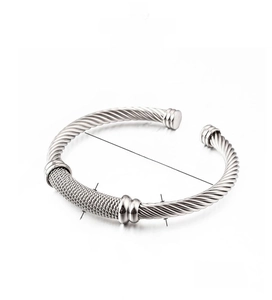 Macro detail of silver mesh weave cuff bracelet with adjustable 55mm steel wire structure