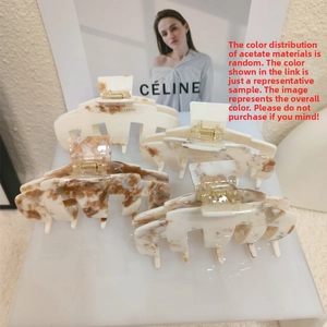 Detail showing marble texture acetic acid hair claw clips in varied color patterns