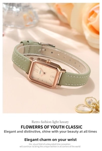 Detail of a square rose gold watch with a green leather strap and罗马 numerals