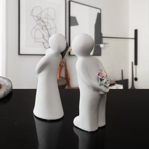 Modern minimalist white ceramic couple statues with tiny roses for home decor and gifts