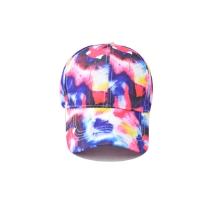 Detailed front view of vibrant tie-dye gradient cotton baseball cap with curved brim