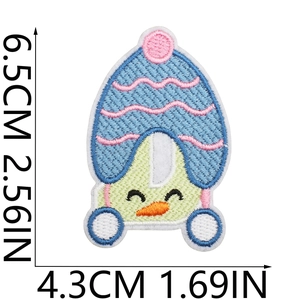 Detailed embroidery patch of cute character with hat, measuring 6.5cm by 4.3cm