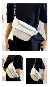 Detail view of white PU leather waist bag with double zippers and stylish chain strap