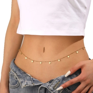 Golden titanium steel belly chain with flower charms worn by a model on white background