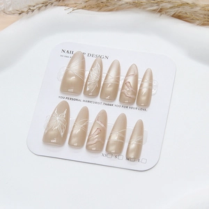 Pearlescent apricot press-on nails with white hand-painted butterfly and artistic lines